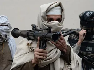 Former Afghan Taliban fighters hand over their weapons as part of a government reconciliation process in Nangarhar province. (AFP)