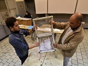 Election officials count ballot papers of the presidential election in the capital Algiers on December 12, 2019. Algeria held a tense presidential election meant to bring stability after a year of turmoil, but voting was marred as protesters stormed polling stations and staged mass rallies in the capital. RYAD KRAMDI / AFP