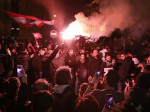 A Lebanese demonstrator uses a flare during an anti-government protest in the downtown area of the capital Beirut, on December 15, 2019.  (AFP/ File Photo)