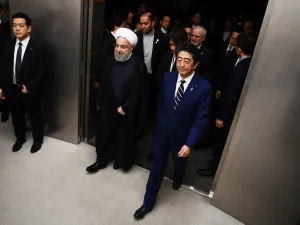 ranian President Hassan Rouhani (L) walks with Japanese Prime Minister Shinzo Abe (R) to a meeting room at the prime minister's office in Tokyo on December 20, 2019. Charly TRIBALLEAU / POOL / AFP