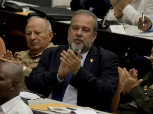 Newly appointed Cuban prime minister Manuel Marrero Cruz (C), attends the closing of the Fourth Regular Session of the National Assembly of Popular Power in its IX Legislature at the Convention Palace in Havana, on December 21, 2019. The National Assembly of Cuba appointed on Saturday the architect Manuel Marrero as Prime Minister of the island, the state press reported. YAMIL LAGE / AFP
