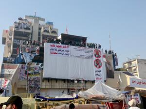 Iraqi anti-government protesters rally during ongoing demonstrations in the capital Baghdad's Tahrir square (AFP)