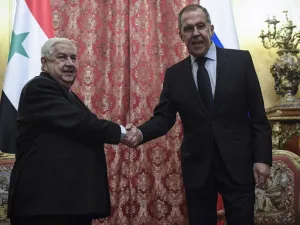 Russian Foreign Minister Sergey Lavrov (R) shakes hands with his Syrian counterpart Walid Muallem during their meeting in Moscow on December 23, 2019. Alexander NEMENOV / AFP