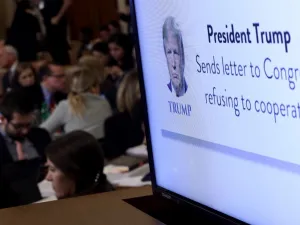 A graphic indicating U.S. President Donald Trump's refusal to cooperate with congressional investigators is shown on a monitor as constitutional scholars Noah Feldman of Harvard University, Pamela Karlan of Stanford University, Michael Gerhardt of the University of North Carolina, and Jonathan Turley of George Washington University testify before the House Judiciary Committee in the Longworth House Office Building on Capitol Hill December 4, 2019 in Washington, DC.  (AFP/ File Photo)