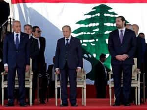 Lebanese Prime Minister Saad Hariri (R), President Michel Aoun (C) and House Speaker Nabih Berri (L) attend a military parade to celebrate the 75th anniversary of Lebanon's independence in downtown Beirut, on November 22, 2018 (AFP Photo/ANWAR AMRO)