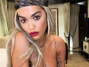 The one-sleeve dress was teamed with a pair of equally unusual shoes,