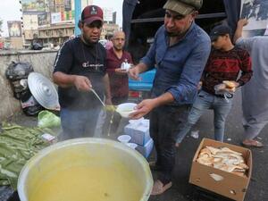 In Baghdad, demonstrators gathered on campuses and in Tahrir Square, with some coming out to support the rallies by distributing food. (AFP/ File Photo)