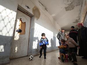 Children of Syrian families displaced from the Maaret Al-Numan region gather in the yard of a former jail turned into a makeshift refugee shelter in the northwestern city of Idlib on December 31, 2019, ahead of activities organised by a local aid association. (AFP/ File Photo)