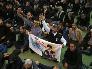 Iranian worshippers attend a mourning prayer for slain Iranian Revolutionary Guards Major General Qasem Soleimani in Iran's capital Tehran on January 3, 2020. Iran warned of "severe revenge" and said arch-enemy the United States bore responsiblity for the consequences after killing one of its top commanders, Qasem Soleimani, in a strike outside Baghdad airport. ATTA KENARE / AFP