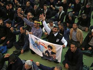 Iranian worshippers attend a mourning prayer for slain Iranian Revolutionary Guards Major General Qasem Soleimani in Iran's capital Tehran on January 3, 2020. Iran warned of "severe revenge" and said arch-enemy the United States bore responsiblity for the consequences after killing one of its top commanders, Qasem Soleimani, in a strike outside Baghdad airport. ATTA KENARE / AFP