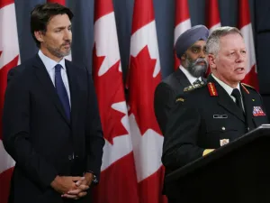 Canadian Prime Minister Justin Trudeau (L), Minister of National Denfence Harjit Sajjan (C) listen as Chief of Defence Staff General Jonathan Vance addresses the media during a news conference January 8, 2020 in Ottawa, Canada. Dave Chan / AFP