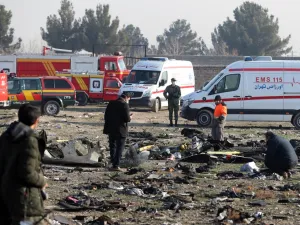 In this file photo taken on January 08, 2020, rescue teams work amidst debris after a Ukrainian plane carrying 176 passengers crashed near Imam Khomeini airport in the Iranian capital Tehran, killing everyone on board. AFP