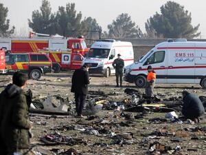 In this file photo taken on January 08, 2020, rescue teams work amidst debris after a Ukrainian plane carrying 176 passengers crashed near Imam Khomeini airport in the Iranian capital Tehran, killing everyone on board. AFP