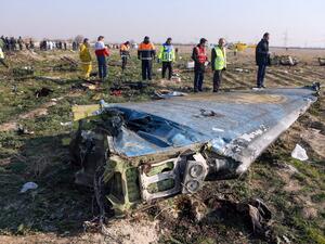 In this file photo taken on January 8, 2020 rescue teams are seen at the scene of a Ukrainian airliner that crashed shortly after take-off near Imam Khomeini airport in the Iranian capital Tehran. Iran said on January 11 that it unintentionally shot down the Ukrainian plane due to 'human error'. Akbar TAVAKOLI / IRNA / AFP