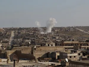 Smoke billows following a reported air strike by pro-regime forces in the town of Maaret Al-Numan in Syria's northwestern Idlib province on January 13, 2020. Abdulaziz KETAZ / AFP