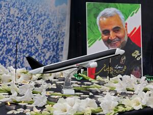 A poster of slain military commander Qasem Soleimani is seen at a memorial for the victims of the Ukrainian plane crash, in University of Tehran on January 14, 2020. Iran announced its first arrests over the shooting down of a Ukrainian airliner last week, as it struggles to contain the fallout from the disaster that sparked three days of protests. ATTA KENARE / AFP