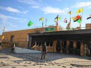Iraqi security guards US embassy in capital Baghdad on 1 January (AFP)