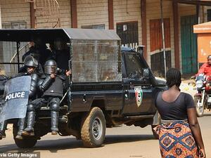 This is the shocking moment a woman was being used as a human shield. (AFP)