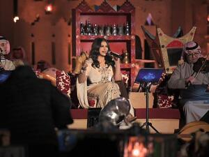 Ahlam chose to wear a black gown along with feather wings (source: @ahlamalshamsi Instagram)