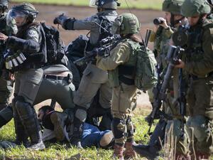Israeli soldiers arrest a Palestinian protester during a demonstration against a US brokered Middle East peace plan near the West Bank village of Tamun near the Jordan Valley on January 31, 2020. AFP