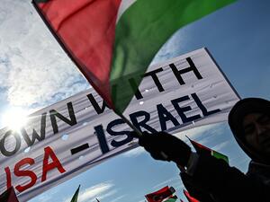 Demonstrators wave Turkish and Palestinian flags during a rally at Yenikapı Square, in Istanbul, to protest against the US-made peace plan, also known as the ‘Agreement of the Century’ Ozan KOSE / AFP