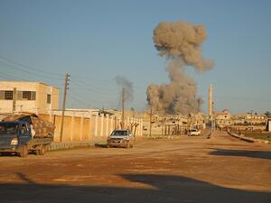 Syrians flee as smoke billows following a reported air strike by Syrian government forces in the village of Kafr Nuran in the northern province of Aleppo on February 9, 2020. AAREF WATAD / AFP
