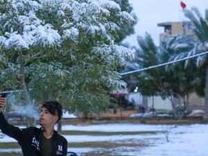 An Iraqi youth poses for a selfie in the snow in the holy Shiite city of Karbala on February 11, 2020. Iraq's capital Baghdad woke up covered in a thin layer of fresh snow, an extremely rare phenomenon for one of the world's hottest countries. Snow also covered the Shiite holy city of Karbala further south and Mosul in the north, where heavier precipitation left a blanket of snow over the city's centuries-old ruins.  Mohammed SAWAF / AFP
