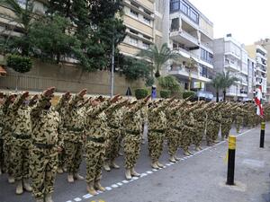 Fighters from the Lebanese Resistance Brigades (Saraya al-Muqawama al-Lubnaniya), a paramilitary group affiliated with Hezbollah, march in the streets of the capital Beirut'ssouthern suburbs to commemorate killed Hezbollah leaders, on February 14, 2020. AFP
