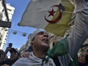 Algerians chant slogans as they march in an anti-government demonstration in the capital Algiers on February 14, 2020. RYAD KRAMDI / AFP