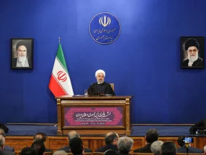 Iranian President Hassan Rouhani speaks during a news conference in the capital Tehran, on February 16, 2020, with the portraits of Iran's (L to R) former and current Supreme Leaders, Ayatollah Ruhollah Khomeini and Ayatollah Ali Khamenei, seen behind. AFP