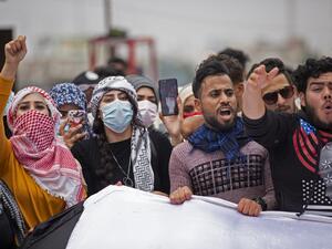 Iraqi students take part in an anti-government protest in the southern city of Basra on February 18, 2020. Since October, the country of 40 million has been rocked by a historically large grassroots movement with big goals: ending corruption, unaccountable sectarian parties and overreach from neighbouring Iran. Hussein FALEH / AFP
