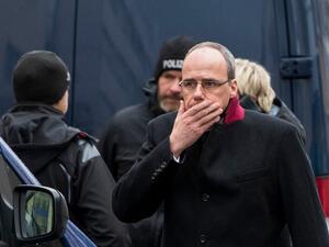 Hesse state Interior Minister Peter Beuth reacts as he arrives at one of the bar target in a shooting at the Heumarkt in the centre of Hanau, near Frankfurt am Main, western Germany, on February 20, 2020, where at least nine people were killed in two shootings late on February 19, 2020. The suspect in two shootings in Germany that killed at least nine people was found dead at home, police said on February 20, 2020. At least nine people were killed in two shootings late on February 19 in Hanau, near the Germ