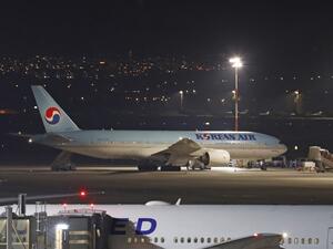 A Korean airplane which arrived from South Korea is pictured after landing at Ben Gurion International Airport on February 22, 2020. Israel refused to allow some 200 non-Israelis to disembark from a plane which arrived from South Korea. AFP
