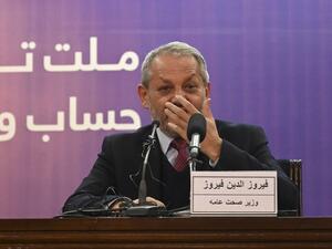 Afghanistan's Health Minister Ferozuddin Feroz gestures as he speaks during a press conference in Kabul on February 24, 2020. Afghanistan has detected its first novel coronavirus case, the country's health minister said on February 24, involving a patient who had recently travelled to Iran, where 12 people have died from the outbreak. WAKIL KOHSAR / AFP