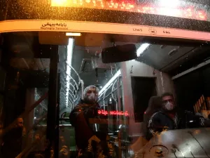 A Tehran Municipality worker cleans a bus to avoid the spread of the COVID-19 illness on February 26, 2020. Iran said Tuesday its coronavirus outbreak, the deadliest outside China, had claimed 15 lives and infected nearly 100 others -- including the country's deputy health minister. The Islamic republic's neighbours have imposed travel restrictions and strict quarantine measures after reporting their first cases in recent days, mostly in people with links to Iran. ATTA KENARE / AFP