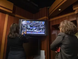 Reporters take photos of the television as they watch the Senate vote on whether or not to acquit President Donald Trump on the two articles of impeachment brought by the House of Representatives to the Senate for trial on Capitol Hill on February 5, 2020 in Washington, DC. After the House impeached Trump last year, the Senate voted today on whether to acquit or convict the President on two articles of impeachment as the trial concludes. Samuel Corum/Getty Images/AFP Samuel Corum / GETTY IMAGES NORTH AMERIC