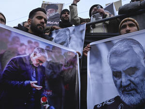 Protesters in Indian Kashmir shout slogans against the United States and Israel as they hold posters with the image of top Iranian commander Qasem Soleimani, who was killed in a U.S. airstrike in Iraq, Jan. 3, 2020. (Tauseef Mustafa/AFP via Getty Images)