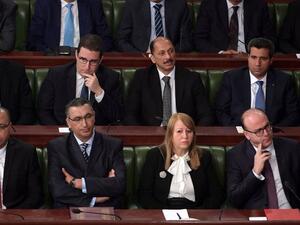 Elyes Fakhfakh, bottom right, has brought parties from across the political spectrum into his Cabinet — and they continue to disagree on several big policy areas. (AFP)