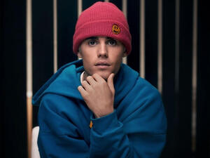 The cartoon artwork has a bubbly looking bear wearing Kobe's original number eight