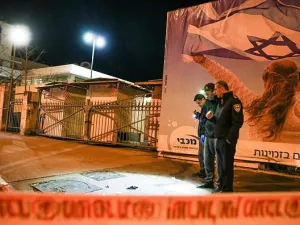 Israeli policemen inspect the site of a car-ramming attack carried out by a Palestinian in Jerusalem in the early hours of this morning  (AFP)