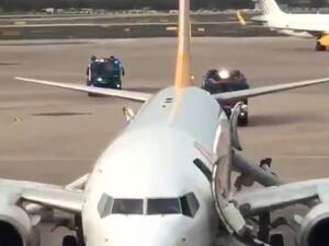 Pictured: The plane after the wheel was set alight in an incident on the runway in Dusseldorf today. (Twitter)