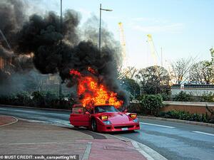The Italian sportscar sent plumes of black smoke into the sky after the back of the vehicle ignited on a street in Monte Carlo, Monaco. (Daily Mail)