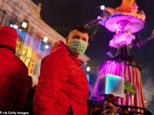 Revellers wear masks to protect themselves from COVID-19 as they attend the Nice carnival in the french riviera city. AFP/File