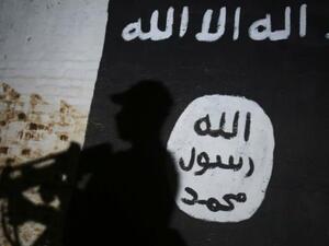 An Iraqi suspected of belonging to IS will face charges of murder and genocide [AFP]