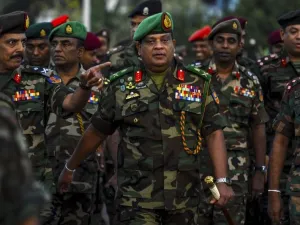 In this Jan 14, 2020, Sri Lanka's Army chief Shavendra Silva (center) arrives to supervise the military operation to revive abandoned rice paddies. (AFP)