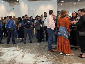 The aftermath at the Mexico City gallery on Sunday - the glass is shattered across the floor and the everyday objects scattered on the floor (Twitter)