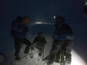 The 'stupid' quartet (one walker pictured sitting down) became trapped near the 4,411ft-high summit after embarking upon a walk up Ben Nevis during freezing 80mph winds (Twitter)
