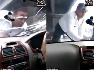 Footage shows the constable pointing to the driver through the windscreen in the Nangloi area of New Delhi, India. (News Lion)