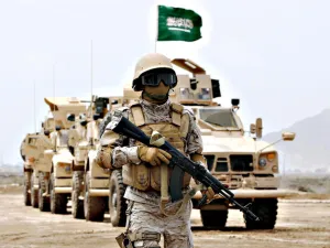 A member of the Saudi forces stands to attention during a presidential visit in Yemen (AFP)