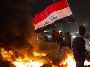 Anti-government demonstrators block a street with burning tyres during a protest in the southern Iraqi city of Basra on February 25, 2020. Hussein FALEH / AFP